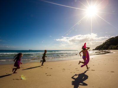Kids running along the Wategos Beach, Byron Bay. Photo: Jon Harris