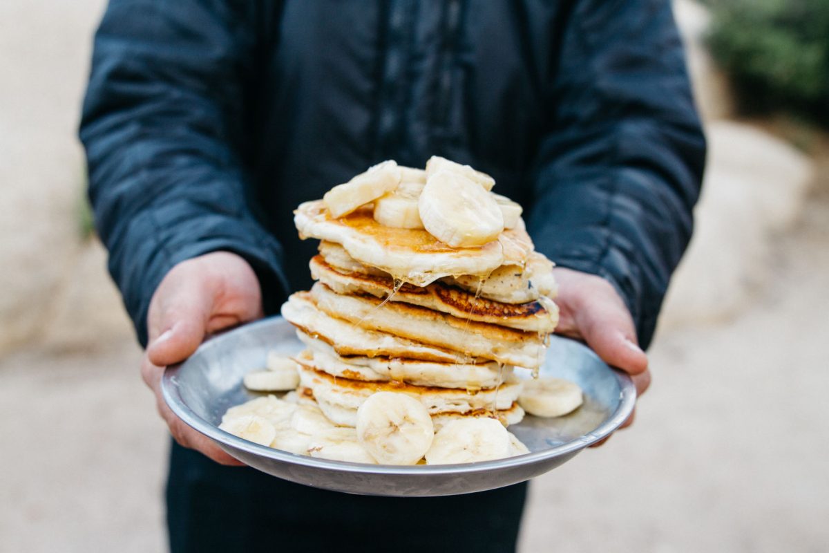 A plate of pancakes and banana slices