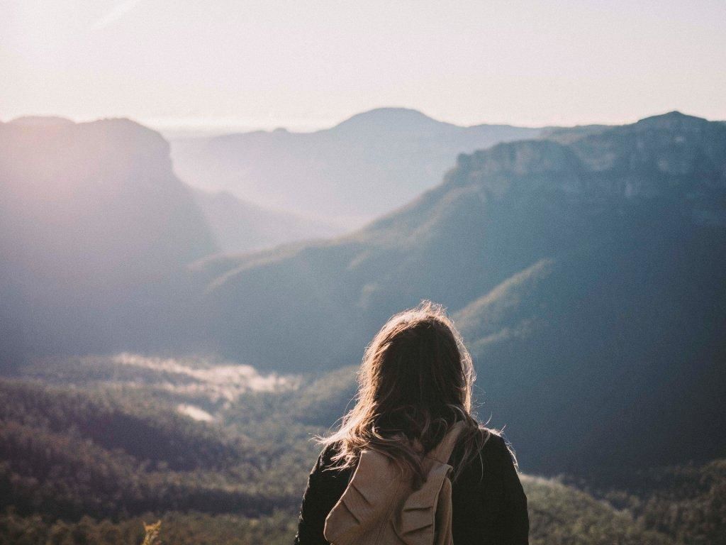 A woman looks out at the valley from Pulpit Rock lookout, Blue Mountains National Park. Photo: Denise Kwong