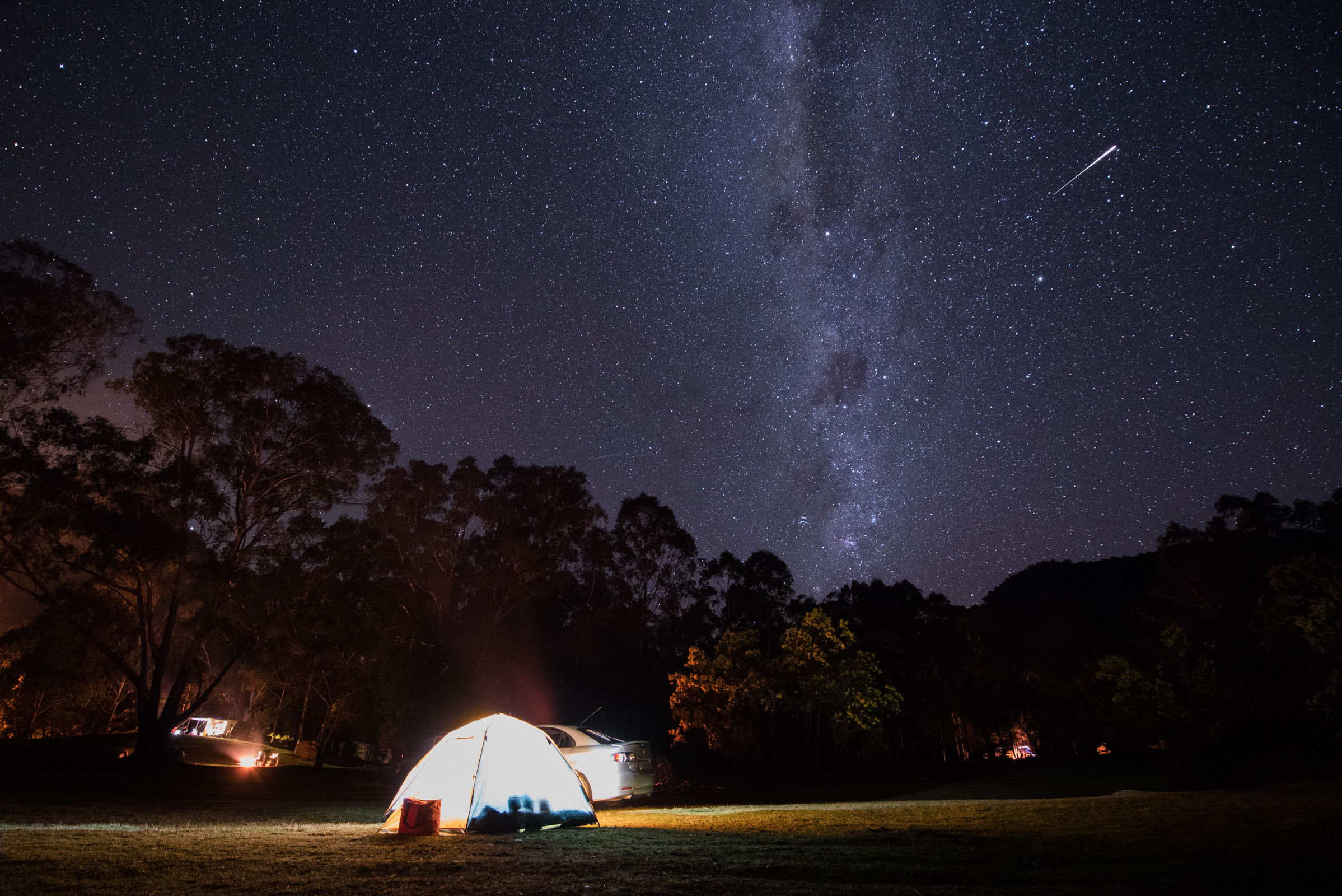 Campground at night under the stars in a NSW national park. Photo: Adrian Mascenon