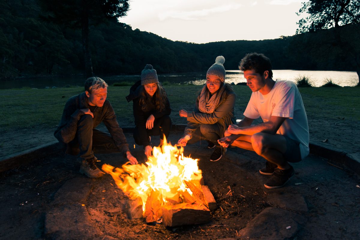 Group around a campfire at The Basin campground in Ku-ring-gai Chase National Park. Photo credit: Tim Clark / DPE