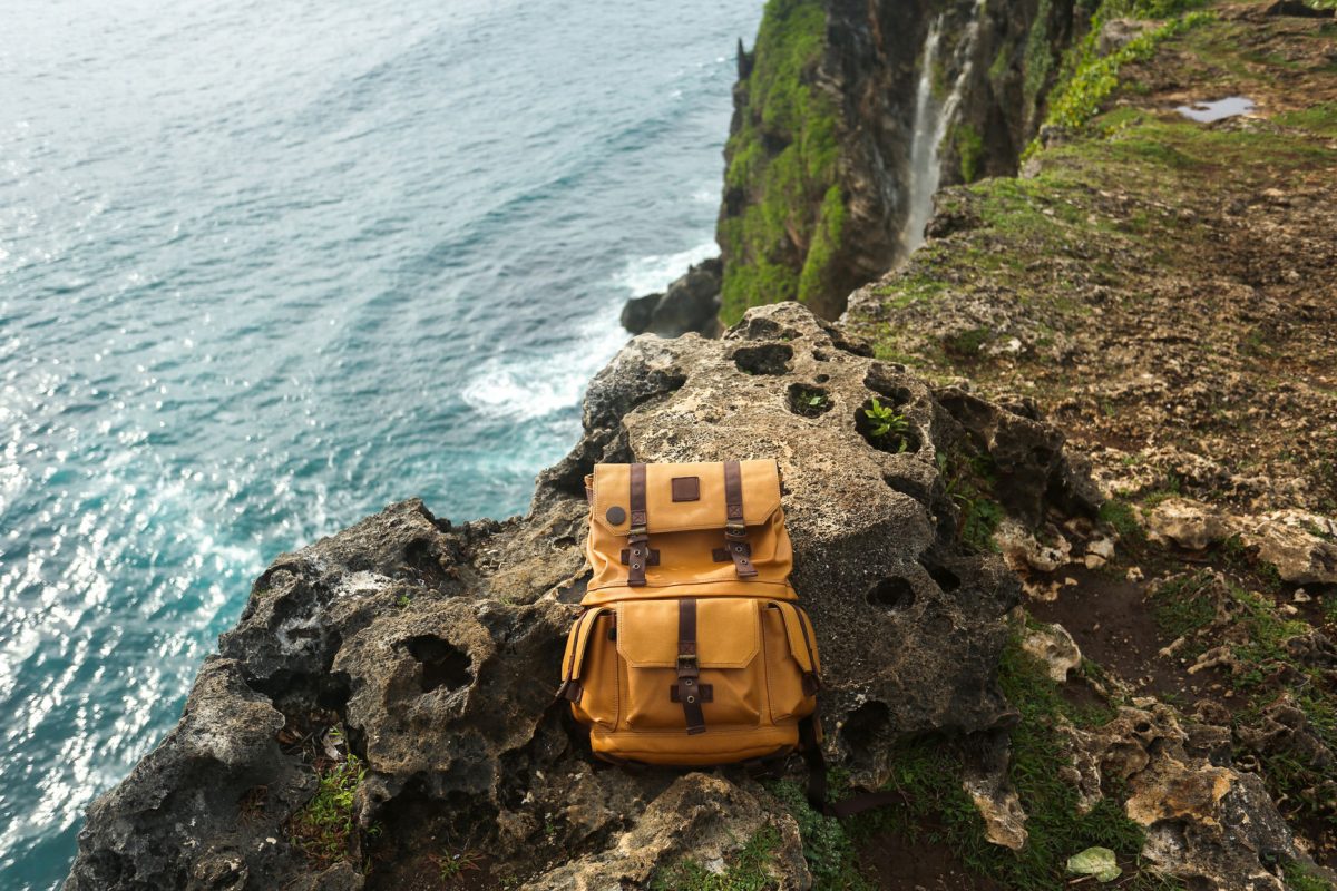 Backpack at the top of a cliff.