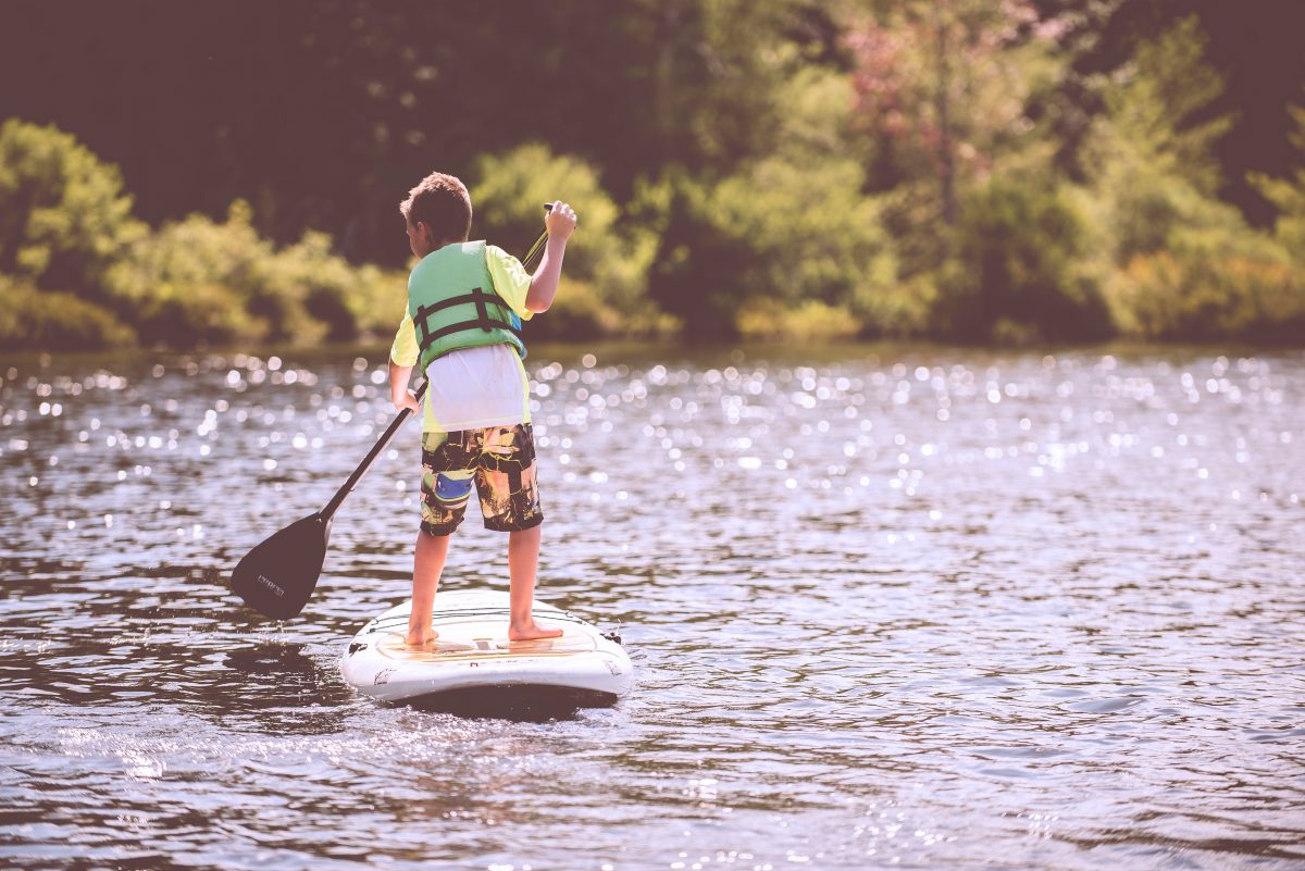 Child paddleboarding on the Murray River. Photo: Ben White