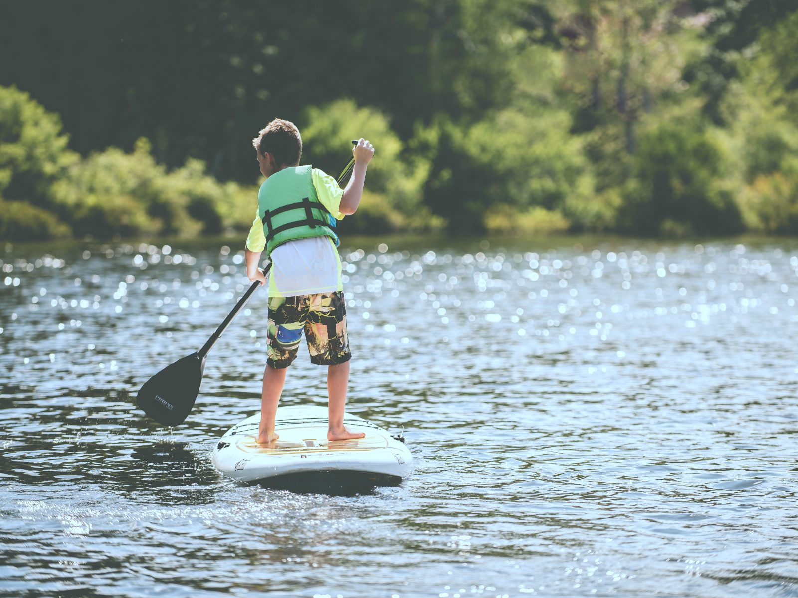 Child paddleboarding on the Murray River. Photo: Ben White