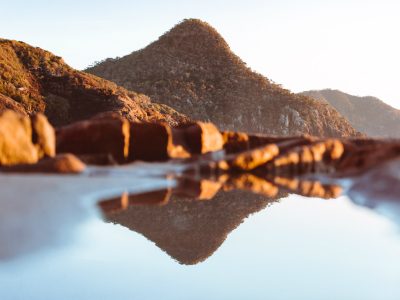 Mountain reflections in a rockpool, Tomaree National Park. Photo: Tim Clark