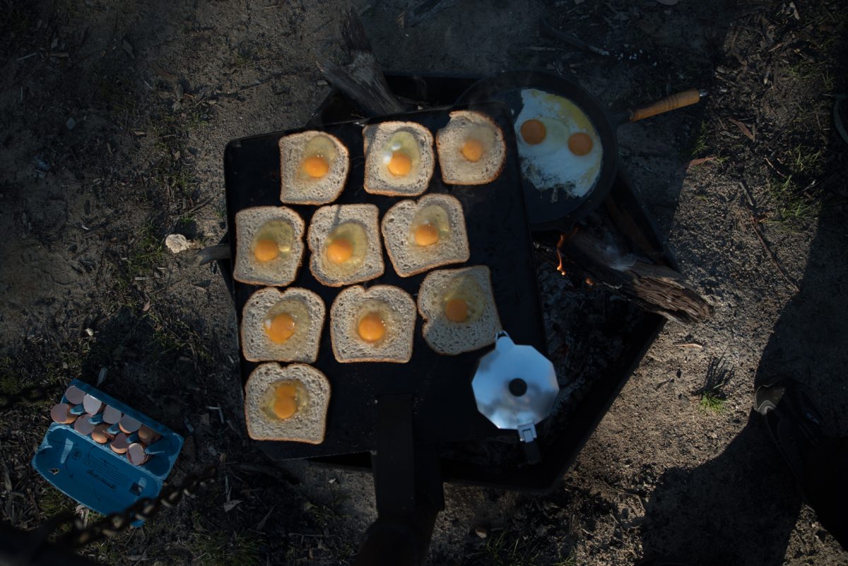 Looking down at food on a campsite grill. Photo: Daniel Parsons/DPIE