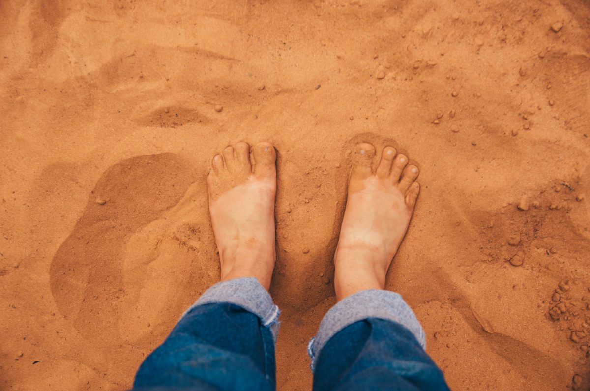Pair of feet in sand
