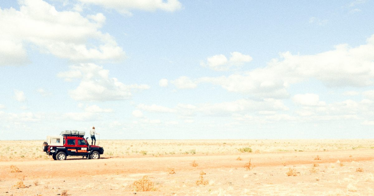 Person standing on a ute in an outback NSW national park. Photo: James Fyfe/DPIE