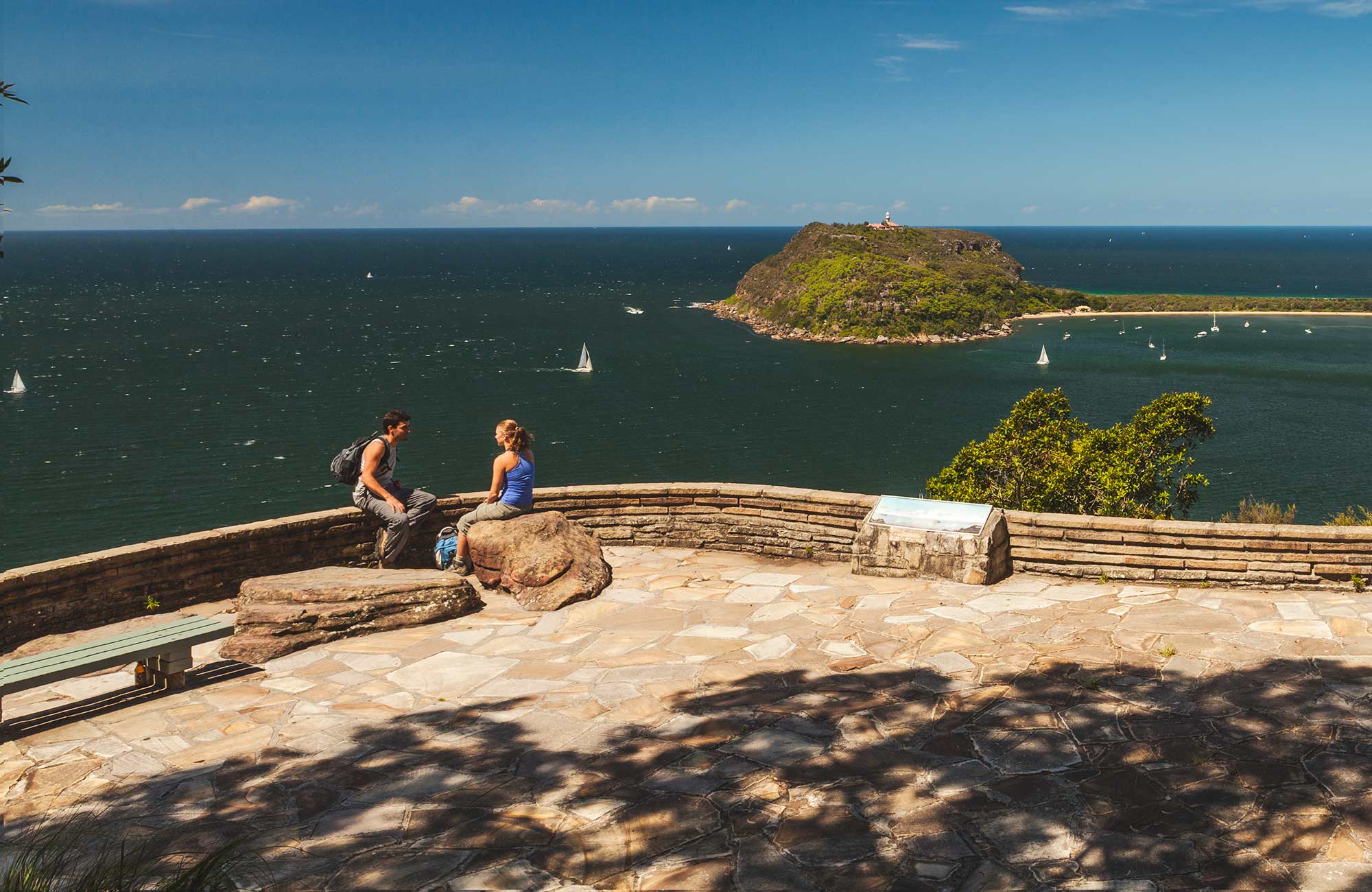 People enjoying the view out to sea from West Head lookout in Ku-ring-gai Chase National Park. Photo: David Finnegan/DPIE