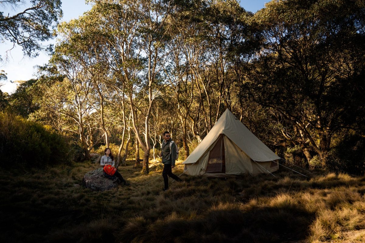 Two people near a tent at Junction Pools campground in Barrington Tops National Park. Photo credit: Rob Mulally/DPIE