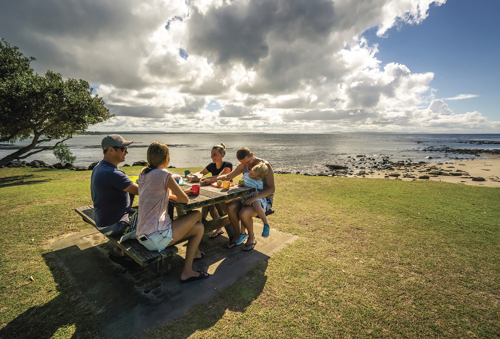 Group of people having a picnic at Woody Head, Bundjalung National Park. Photo: John Spencer/DPIE