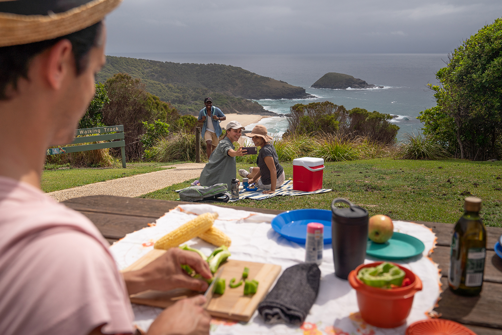 Group of people having a picnic at Hat Head National Park. Photo: Rob Mulally/DPIE