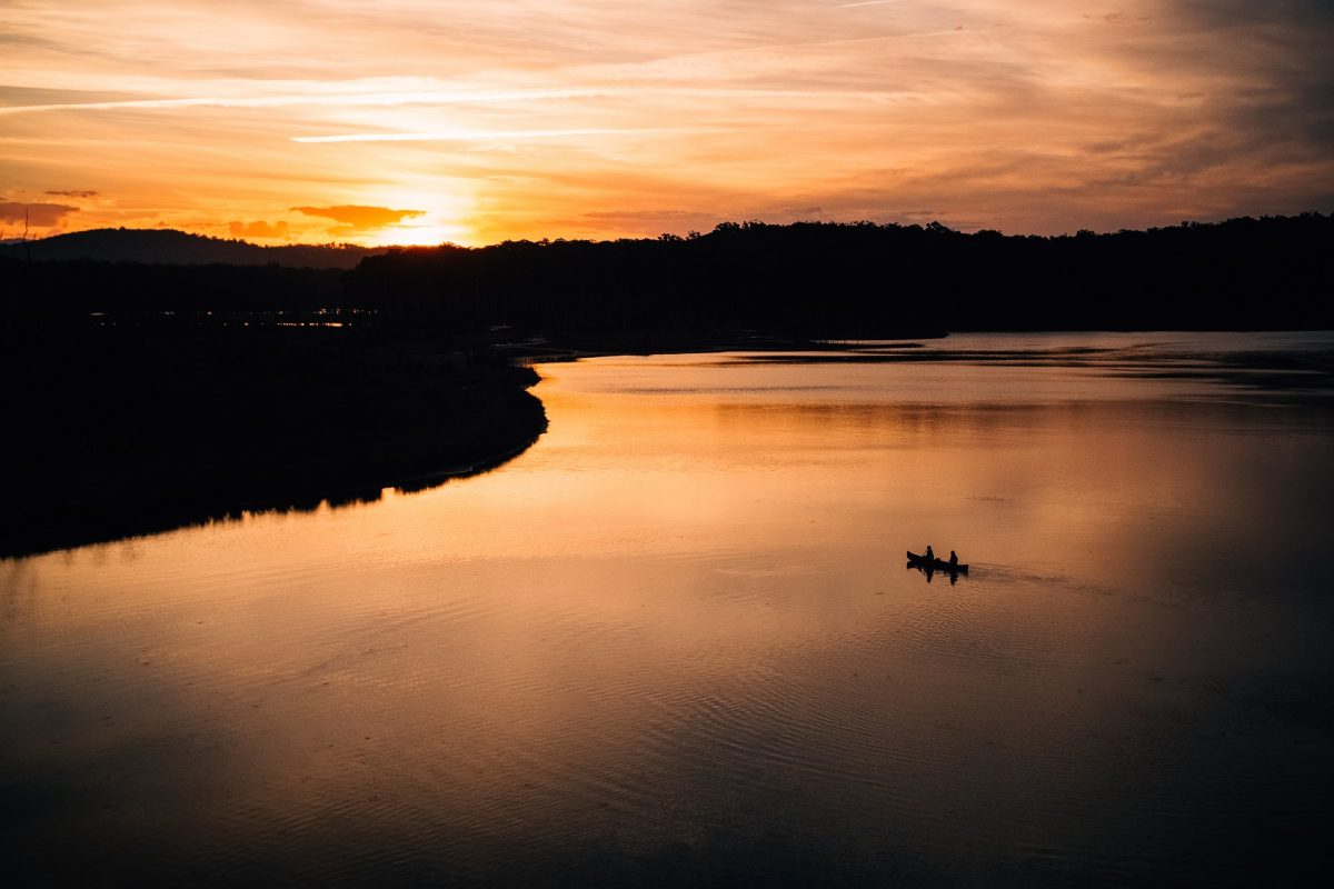 Canoeing into the sunset on Durras Lake in Murramarang National Park. Photo credit: Melissa Findley/DPIE