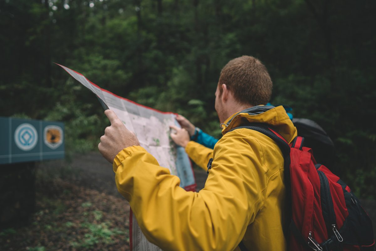 A guy looking at a map in Border Rangers National Park