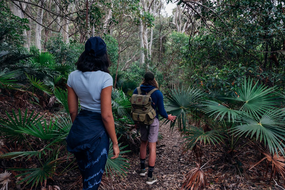 Two people on a walk in Murramarang National Park