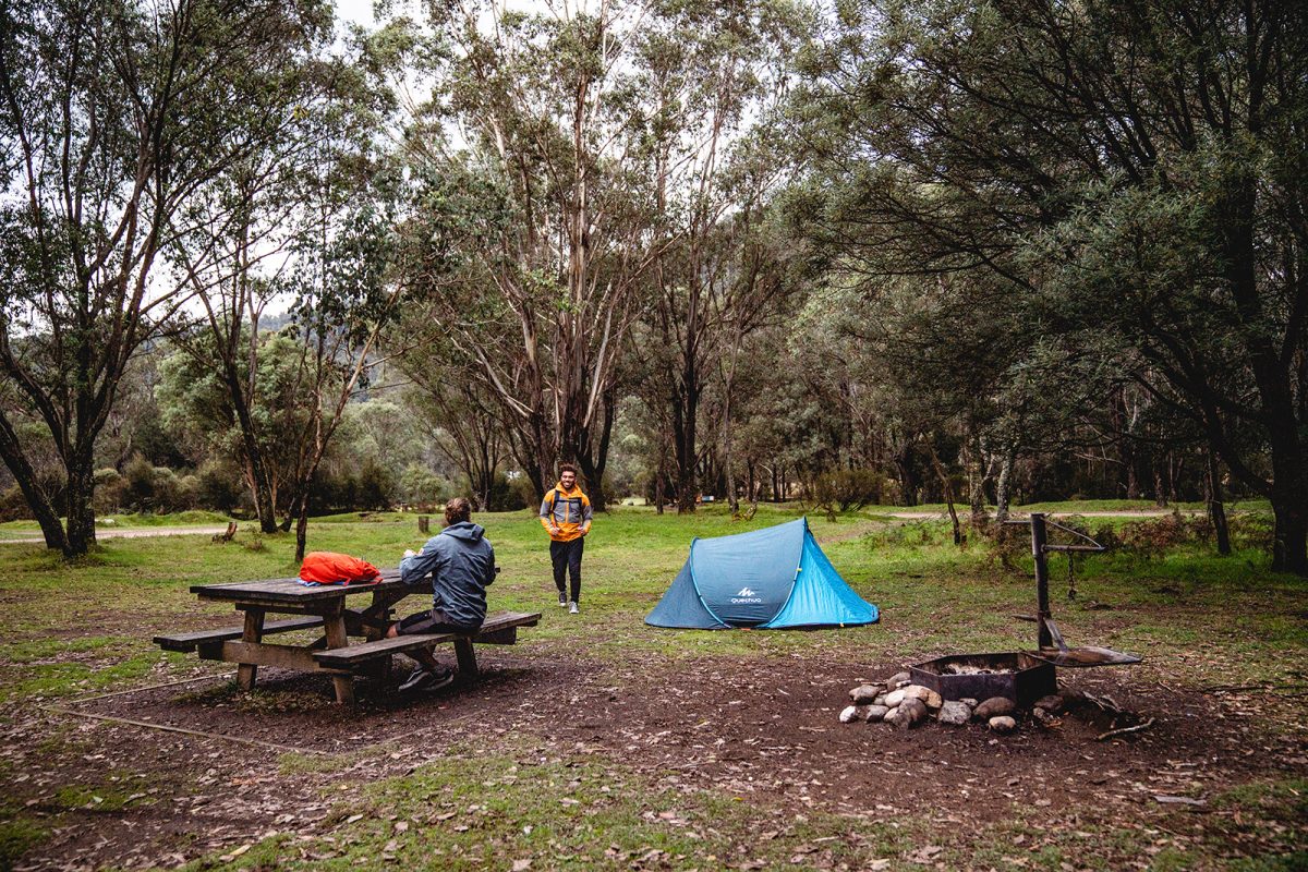 Two guys greeting each other at Geehi Flats campground, Khancoban area in Kosciuszko National Park. Photo: Rob Mulally/DPIE