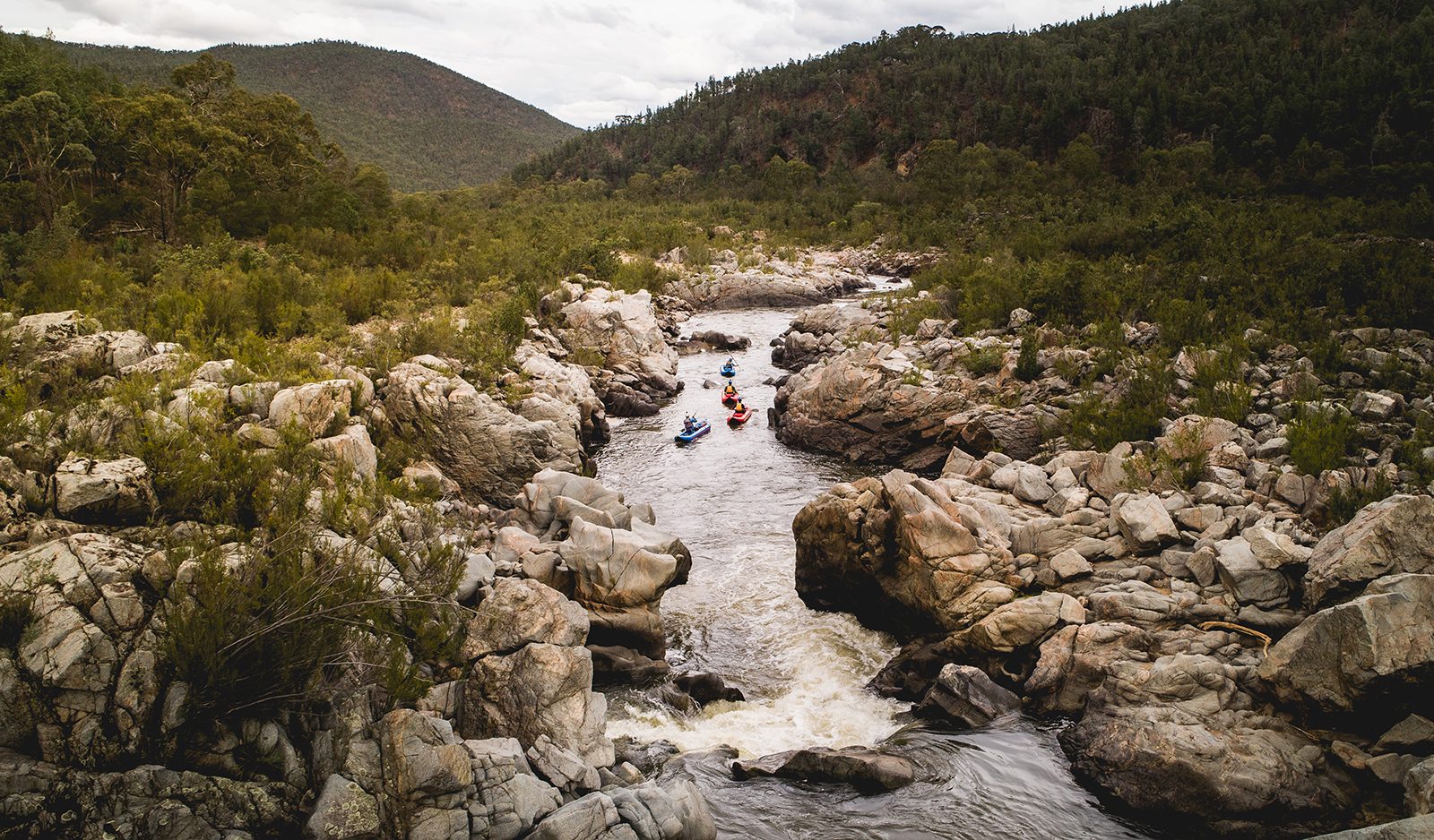 Aerial view of four people kayaking on the Snowy River, Kosciuszko National Park. Photo: Rob Mulally/DPIE