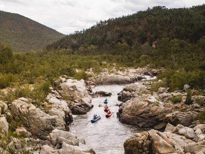 Aerial view of four people kayaking on the Snowy River, Kosciuszko National Park. Photo credit: Rob Mulally/DPIE