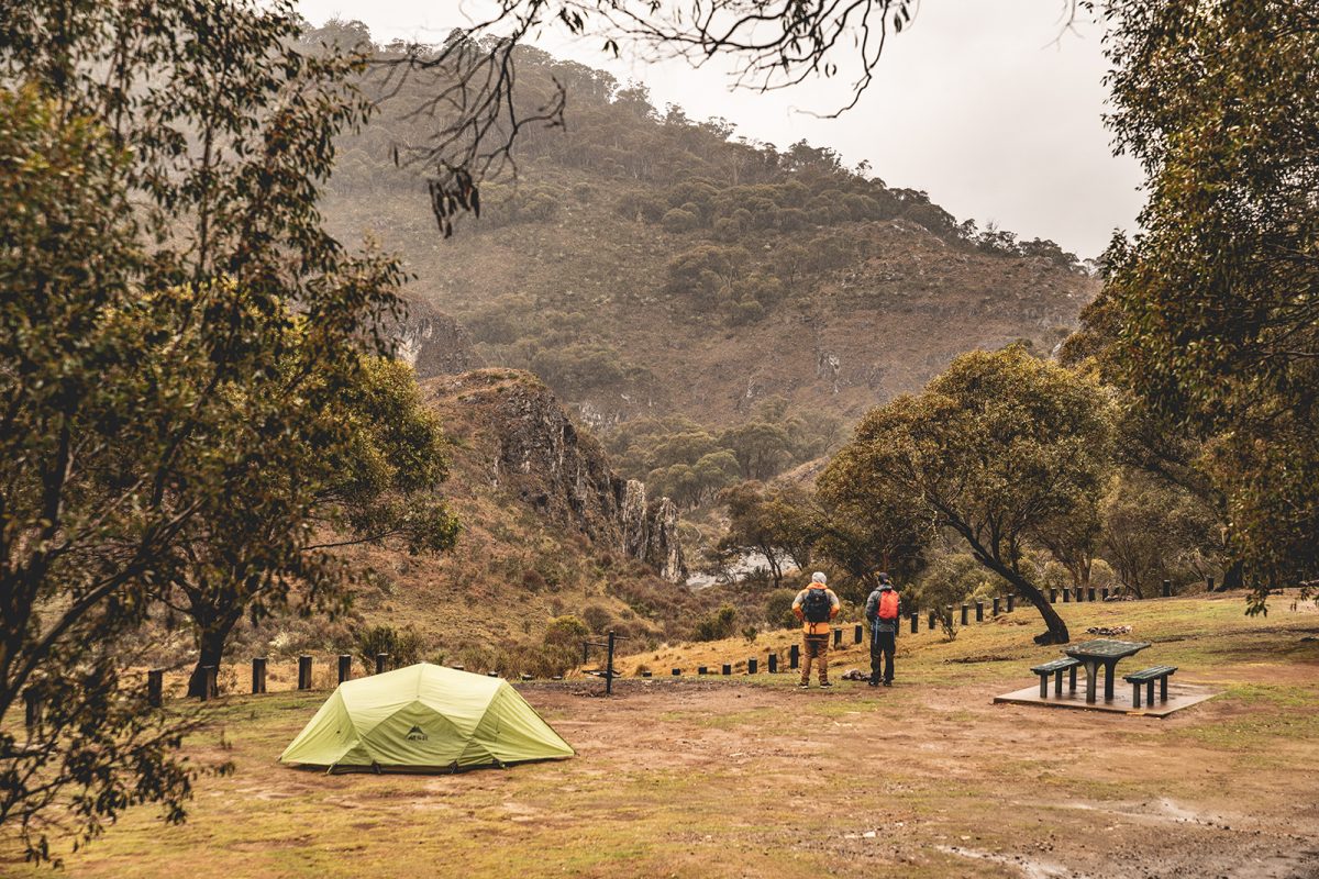Two people looking at Clarke Gorge from Blue Waterholes campground, High Plains area in Kosciuszko National Park. Photo: Rob Mulally/DPIE