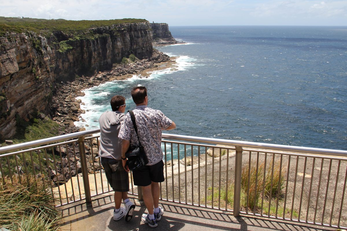 Two people at the Fairfax lookout, Fairfax walk, North Head, Sydney Harbour National Park. Photo: John Yurasek/DPIE