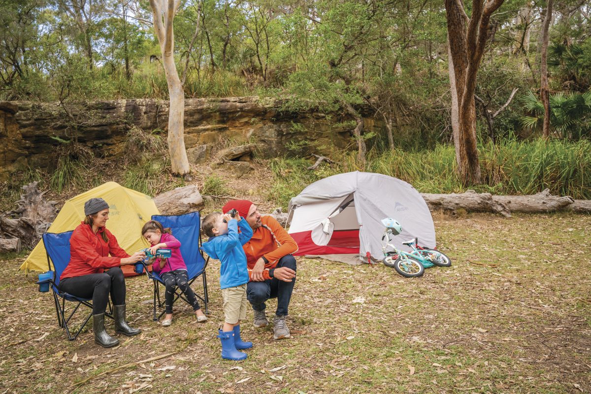 A family of four birdwatching, Bonnie Vale Campground, Royal National Park. Photo: John Spencer/DPIE