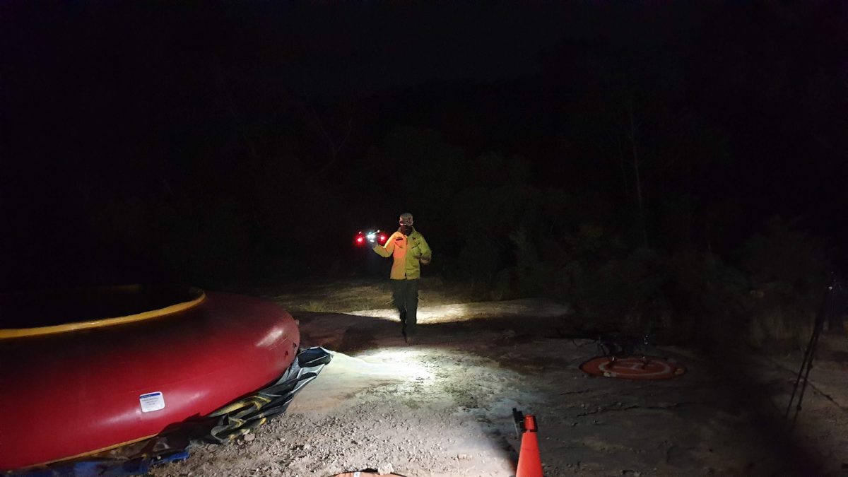 NSW National Parks Drone pilot with drone at night. Photo credit: Scott / DPIE