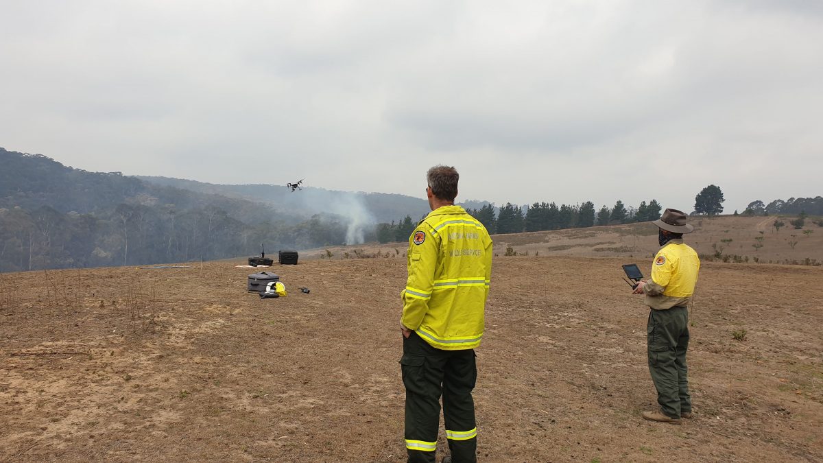 Drone pilots working in pairs. Launch and land drones from the fireground. Photo: Scott Colefax / DPIE
