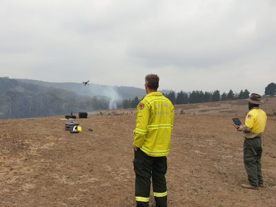 Drone pilots working in pairs. Launch and land drones from the fireground. Photo credit: Scott Colefax / DPIE