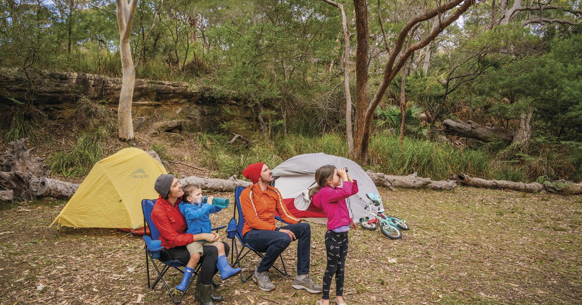 A family with two parents and two young kids Birdwatching, Royal National Park. Photo: John Spencer / DPIE