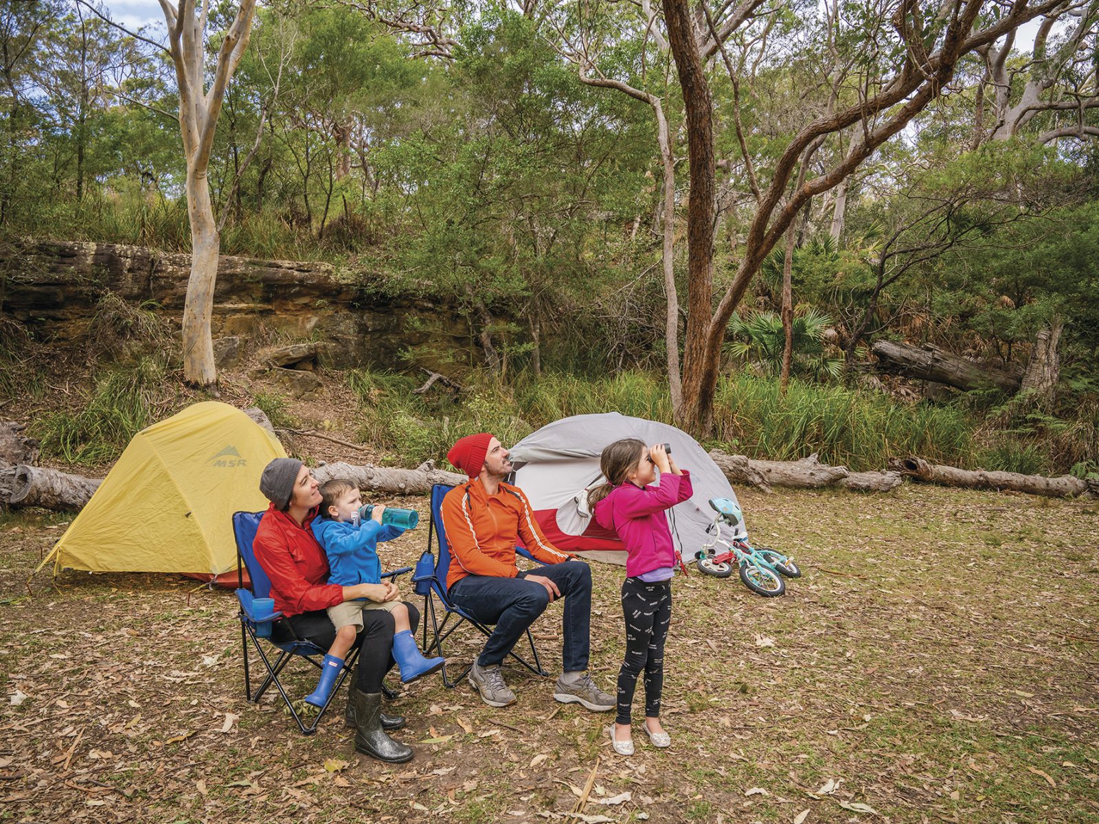A family with two parents and two young kids Birdwatching, Royal National Park. Photo credit : John Spencer / DPIE