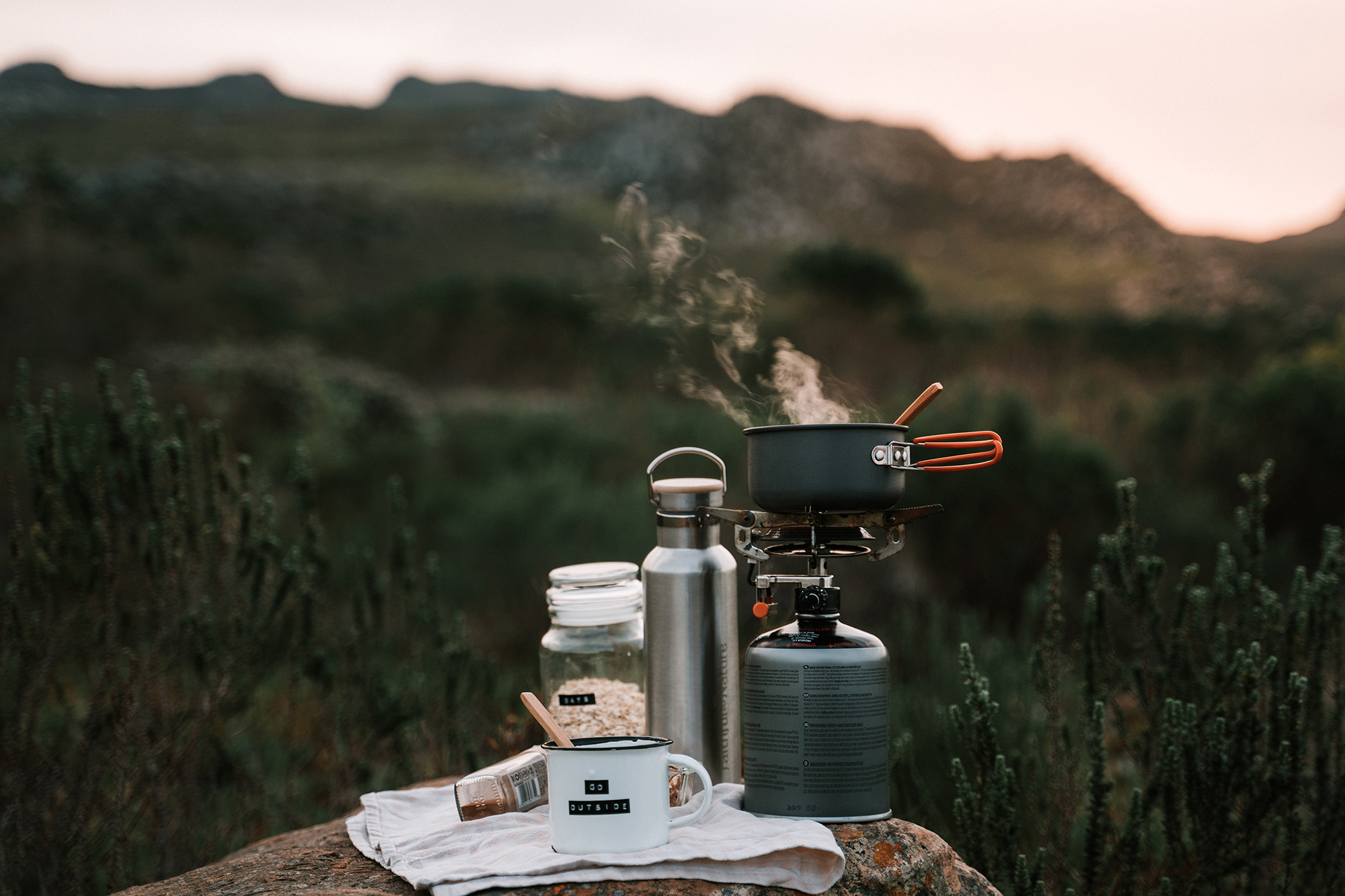 Camping stove with items to make a hot drink. Photo: Taryn Elliot via Pexels