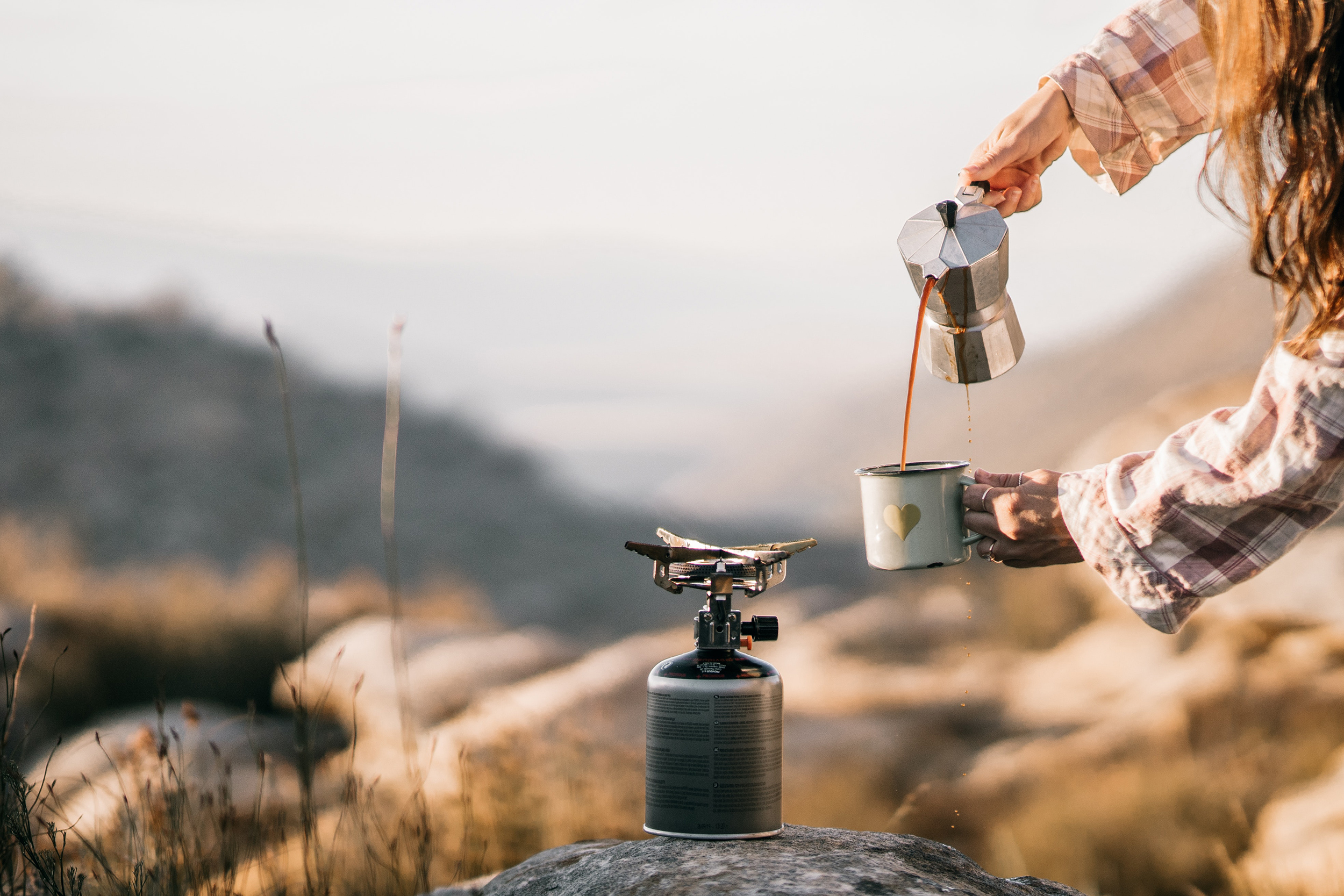 A person pouring coffee from a Mocha pot. Photo: Taryn Elliot via Pexels