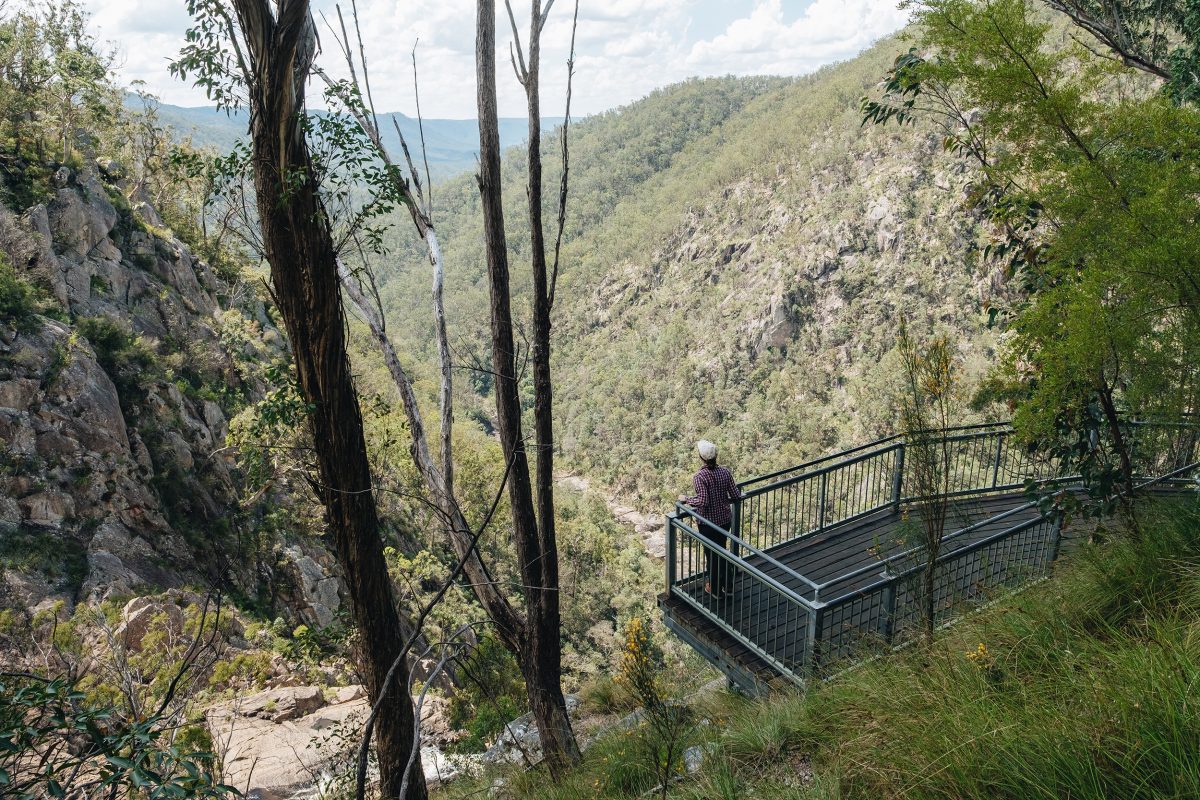 Standing at the lookout overlooking the valley at Boonoo Boonoo Falls lookout. in Boonoo Boonoo National Park. Photo: Harrison Candlin © Harrison Candlin / DPE