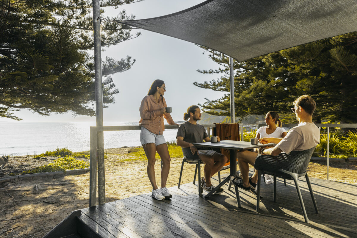 People at NRMA Murramarang Beachfront Holiday Resort cabins. Photo credit: Destination NSW