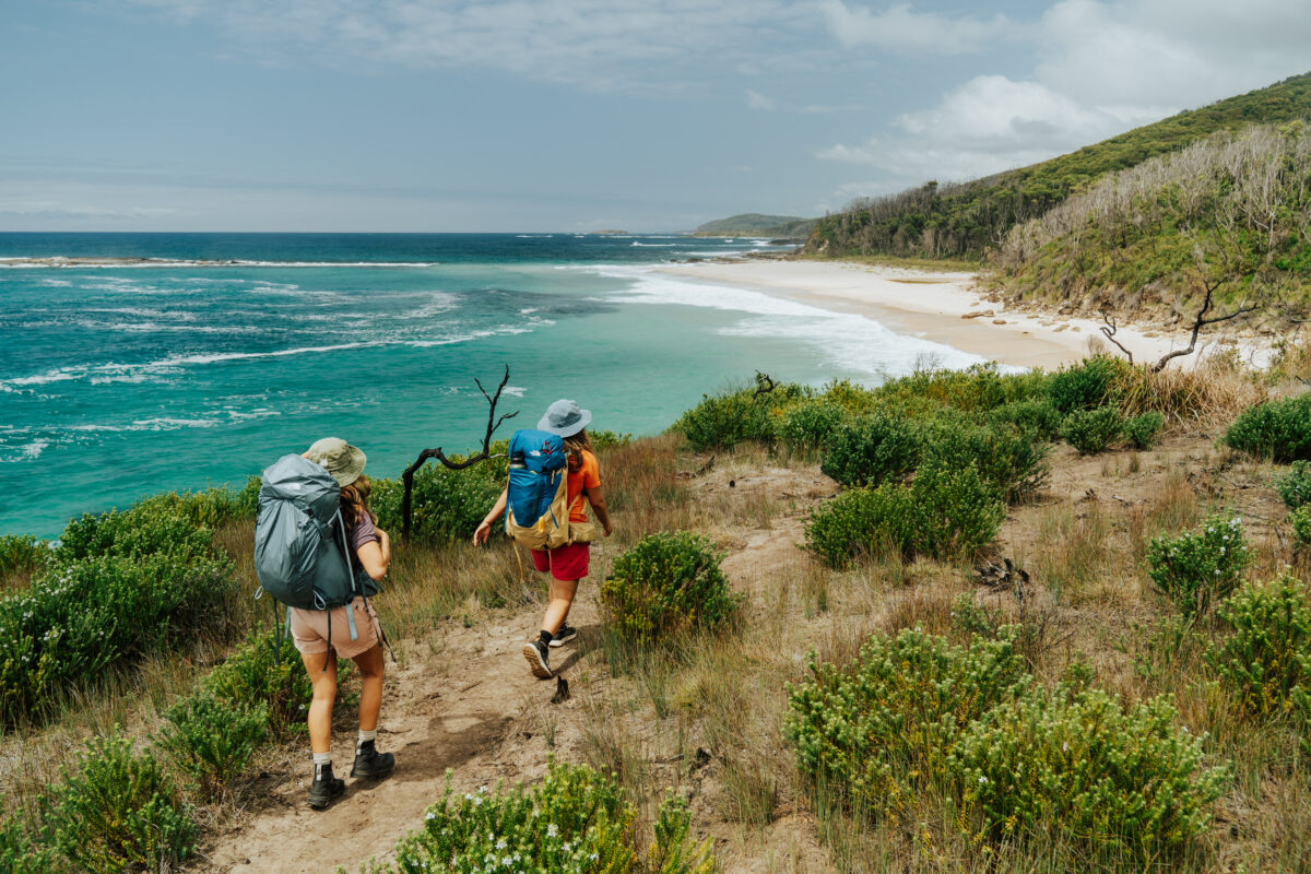 Two people walking along the Murramarang South Coast Walk. Photo credit: Remy Brand / DPE