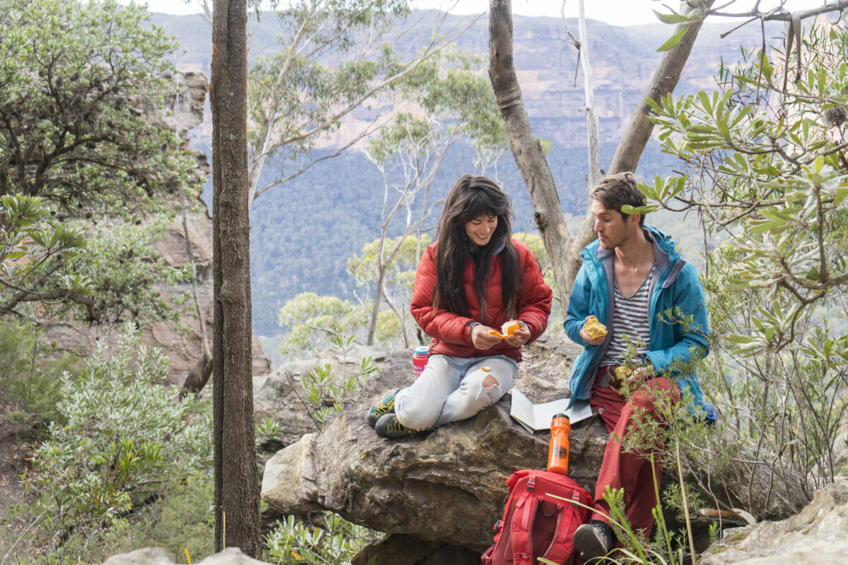 A couple having a lunch break, Grand Canyon track, Blue Mountains National Park. Photo credit: Simone Cottrell / DPE