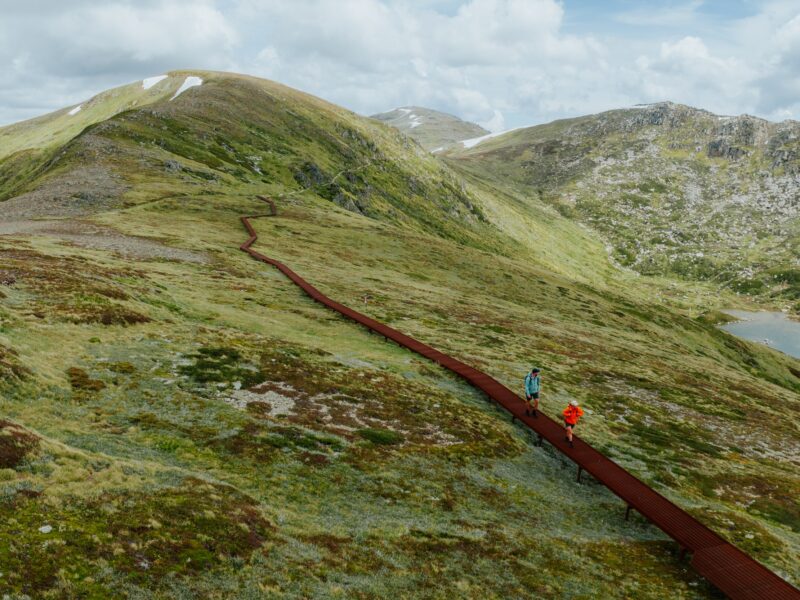 Two walkers on the Main Range walk section of the Snowies Alpine Walk. Photo credit: Daniel Parsons/DCCEEW