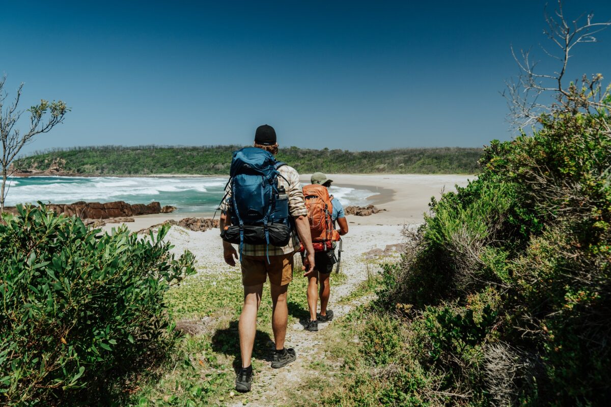 Two walkers at Saltwater Creek on the Light to Light Walk. Photo credit: Remy Brand/DCCEEW
