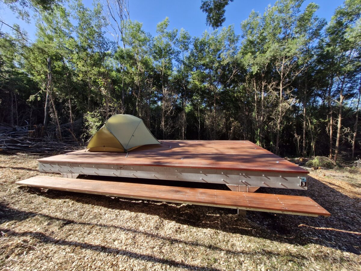 Tent set up on a camping platform at Hegarts campground on the Light to Light Walk.